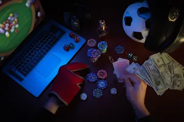 A cheerful woman in traditional clothing using her smartphone during a festive moment, showing how easily the BET3999 app fits into everyday life.