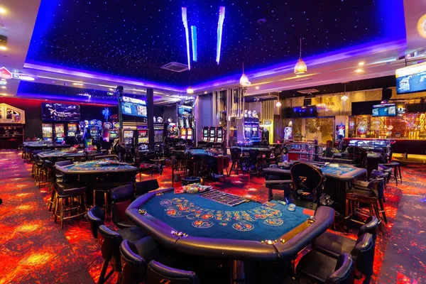 BET3999 Casino — Step inside our high-end casino experience A glamorous woman holding casino chips in a neon-lit environment, representing the premium online casino atmosphere of BET3999.